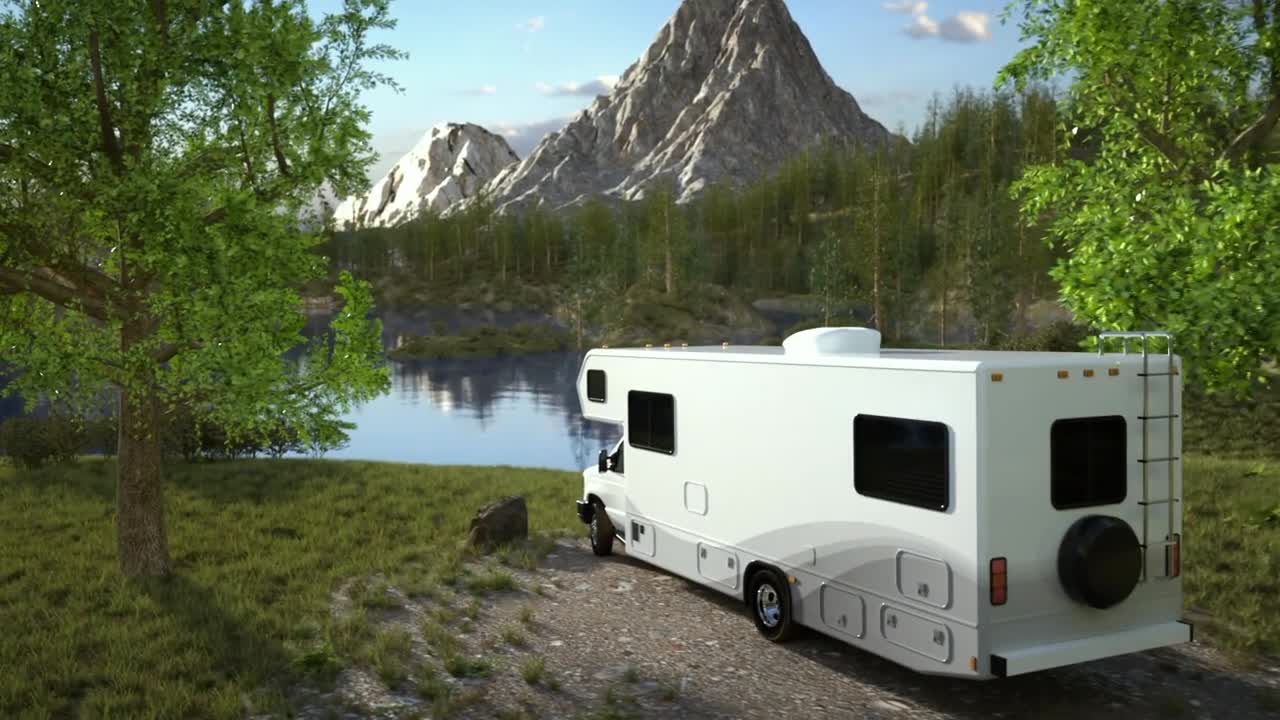 RV parked next to lake with a mountain in the background