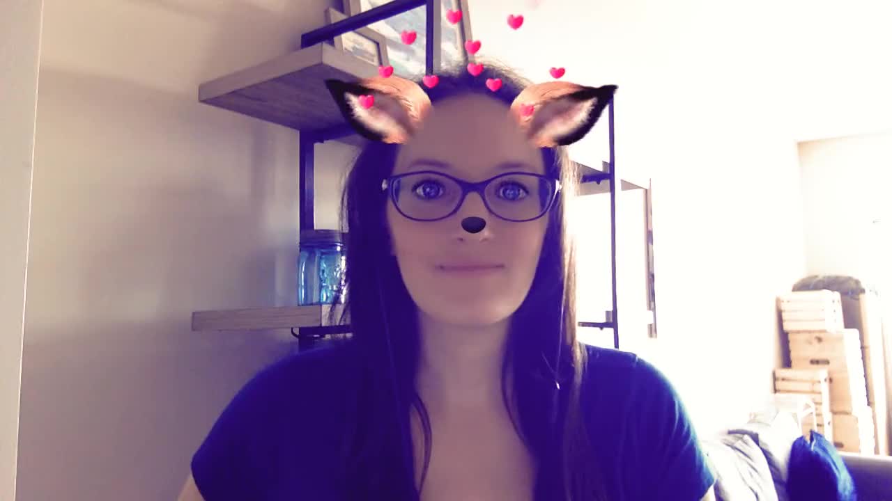 A woman using a Snapchat filter in a video call.