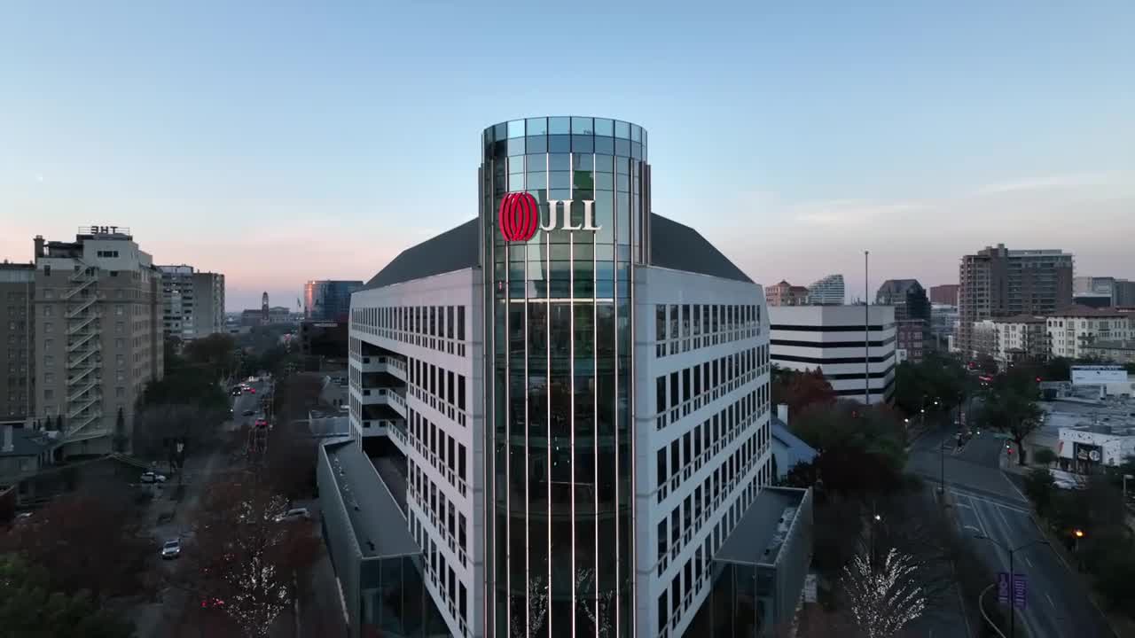 JLL Technologies overview video thumbnail image of commercial real estate buildings and property