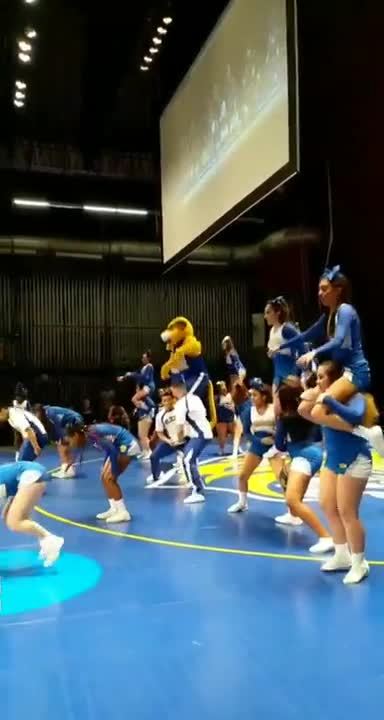 The JWU Cheer Squad cheers on the home team