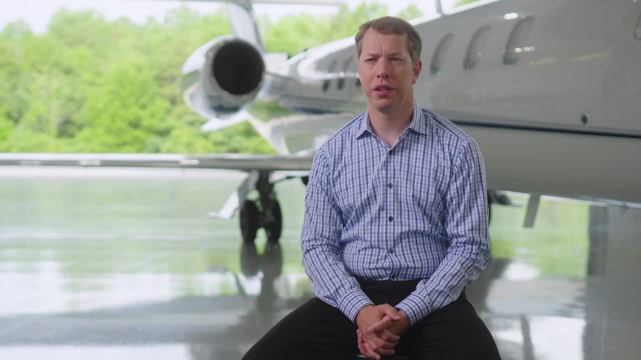 Brad Keselowski on his mobile device in his aircraft